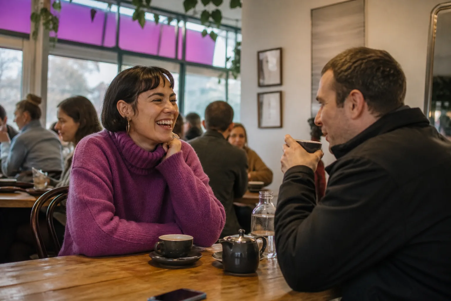 Two people meeting at a busy café in central Adelaide