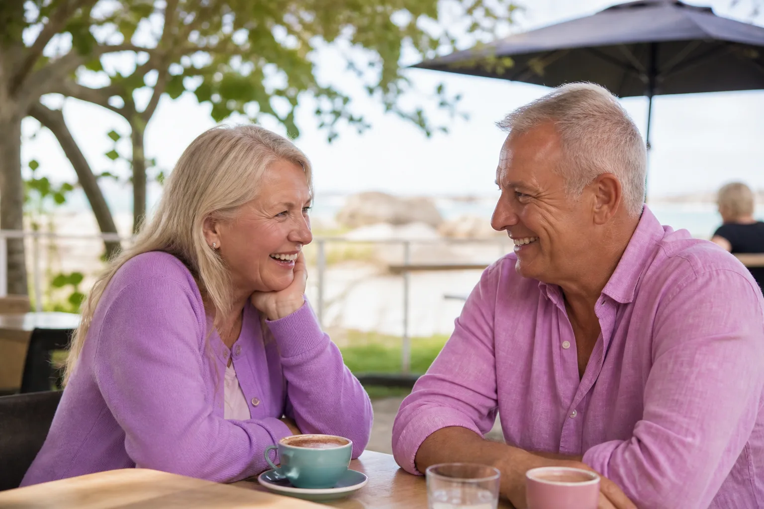 Mature couple talking over coffee at an outdoor Adelaide cafe